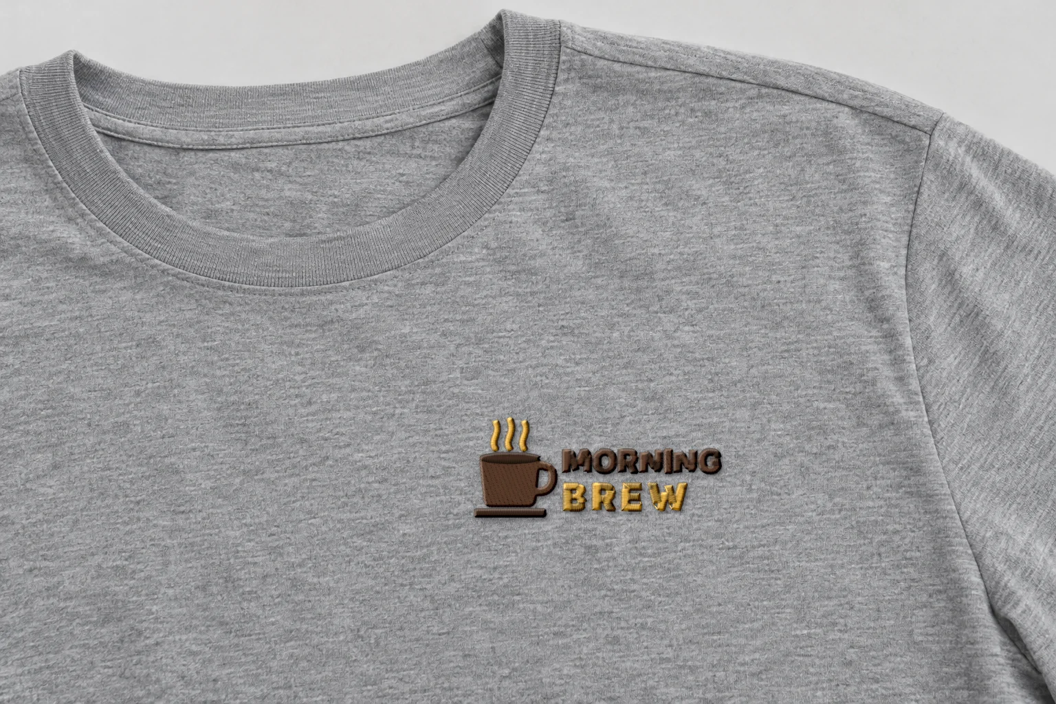 Mockup: the stitched café logo on the left chest of a t-shirt